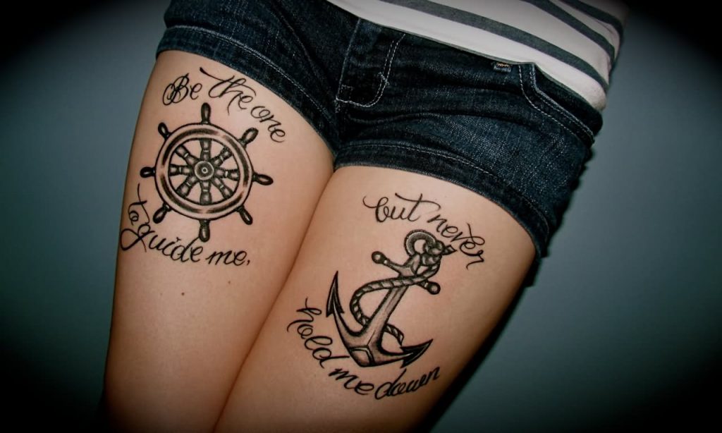 This image has an empty alt attribute; its file name is Black-Ink-Sailor-Anchor-And-Wheel-Tattoo-On-Both-Thigh-1024x614.jpg
