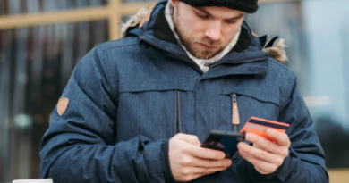 man shopping on phone with card