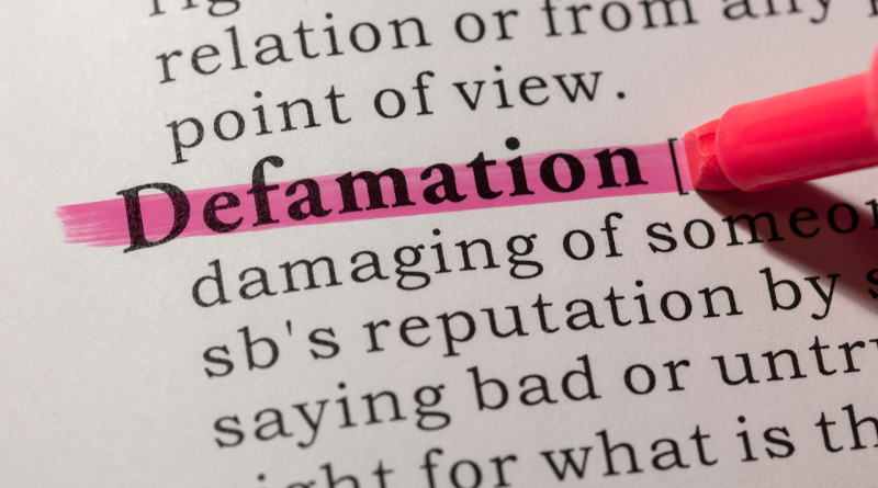 A picture of someone highlighting the word ‘defamation,’ Jerome Karam is suing for defamation and extortion.