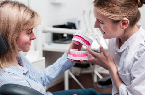 Smile Restoration in Karachi: Dental Implants vs. Dentures – Which is Right for You? – TIME BUSINESS NEWS