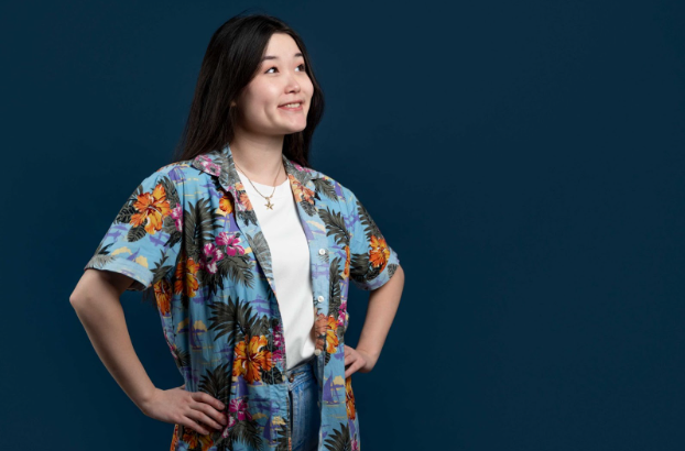 Model posing in a short-sleeve women shirt styled with a jean for a professional look.