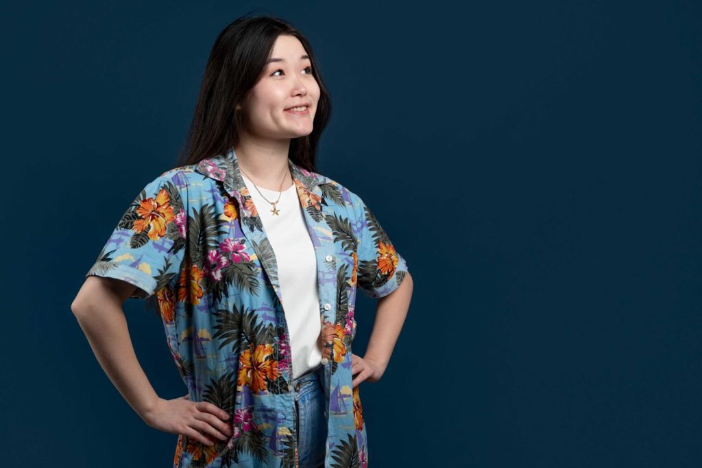 Model posing in a short-sleeve women shirt styled with a jean for a professional look.