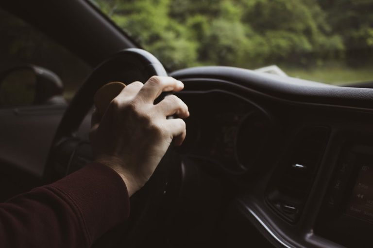 Photo by John Rapone : https://www.pexels.com/photo/hand-resting-on-steering-wheel-8185687/