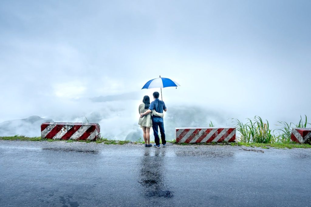 Darjeeling monsoon and couple standing and enjouying the view